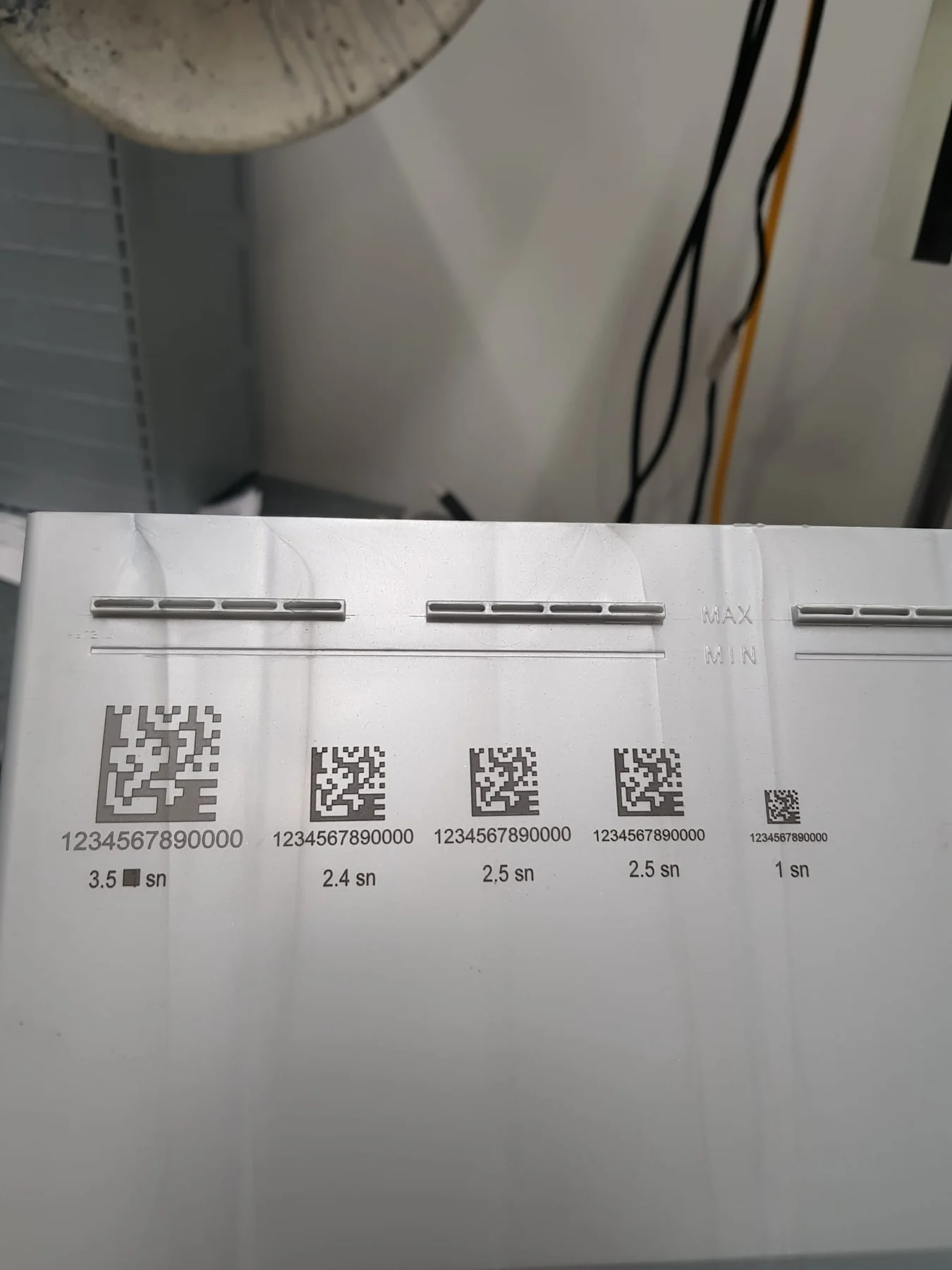 Data Matrix laser marking size tests on white plastic